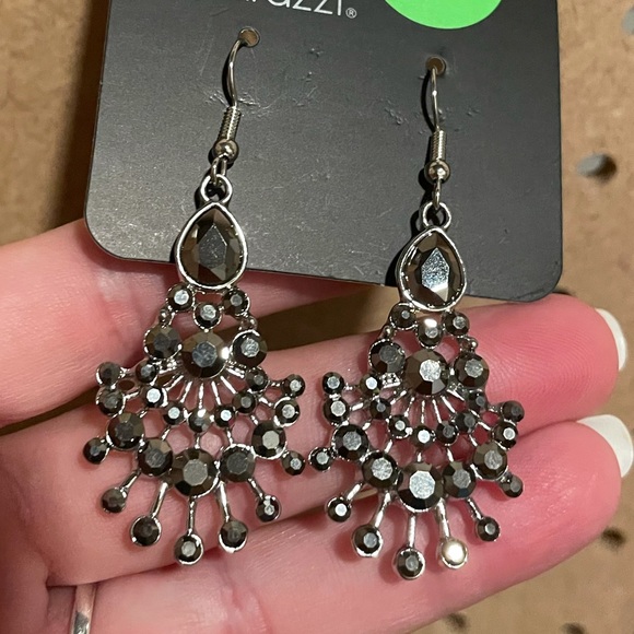 Smoky gray stones on a spoke design. Fishhooks.